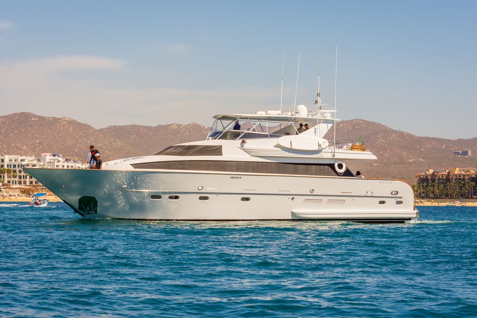 Private motor yacht on clear blue water near Cancún